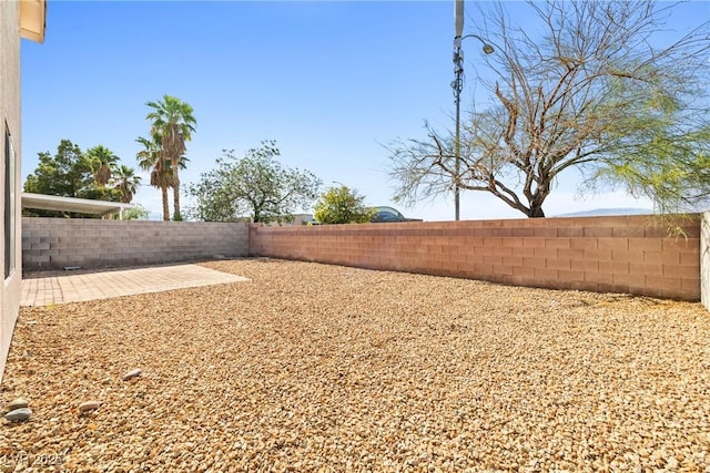 5112 Foggia Ave, Las Vegas, NV 89130 - fenced backyard with a patio