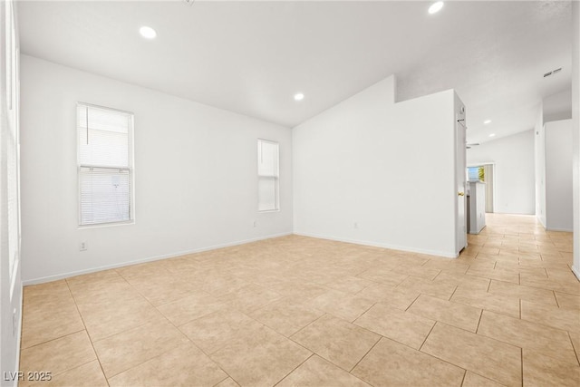 5112 Foggia Ave, Las Vegas, NV 89130 - spare room featuring recessed lighting, light tile patterned floors, plenty of natural light, lofted ceiling, and baseboards