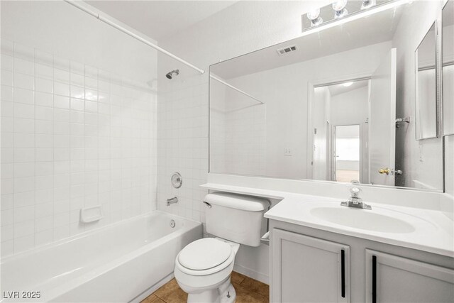 5112 Foggia Ave, Las Vegas, NV 89130 - bathroom with toilet, shower / tub combination, vanity, and tile patterned flooring