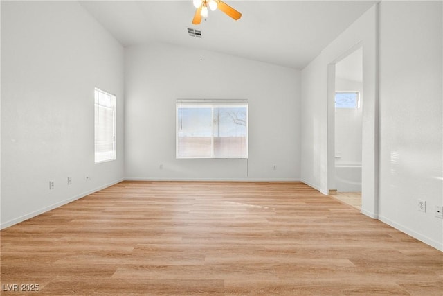 5112 Foggia Ave, Las Vegas, NV 89130 - empty room featuring plenty of natural light, vaulted ceiling, ceiling fan, light wood finished floors, and baseboards