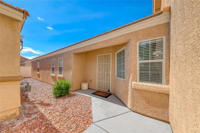 8567 Little Fox St, Las Vegas, NV 89123 - property entrance with stucco siding
