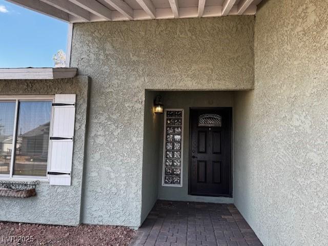 6421 Doby Peak Dr, Las Vegas, NV 89108 - entrance to property featuring stucco siding