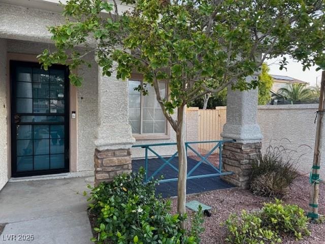 2419 Pebble Springs Ct, Henderson, NV 89074 - doorway to property with stucco siding