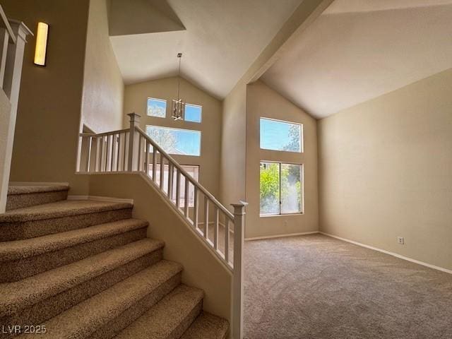 2419 Pebble Springs Ct, Henderson, NV 89074 - stairs with carpet floors, high vaulted ceiling, and a chandelier