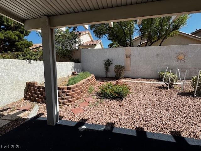 2419 Pebble Springs Ct, Henderson, NV 89074 - fenced backyard with a patio area