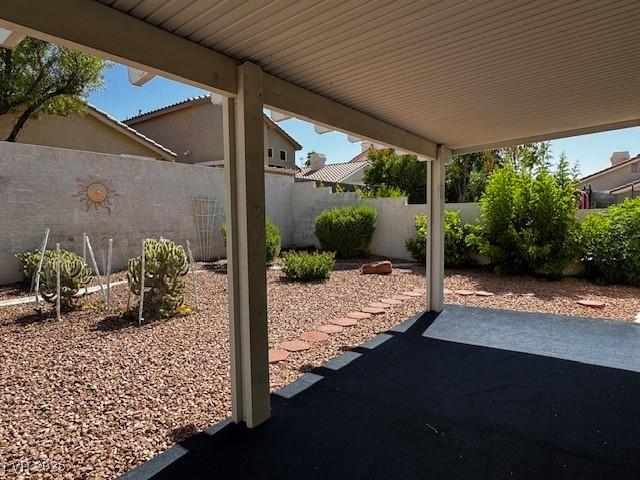 2419 Pebble Springs Ct, Henderson, NV 89074 - fenced backyard featuring a patio