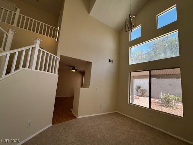 2419 Pebble Springs Ct, Henderson, NV 89074 - carpeted spare room featuring high vaulted ceiling and ceiling fan