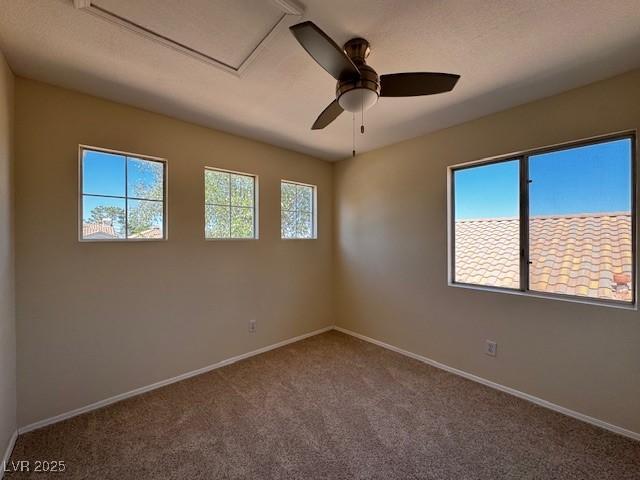 2419 Pebble Springs Ct, Henderson, NV 89074 - carpeted spare room with baseboards and a ceiling fan
