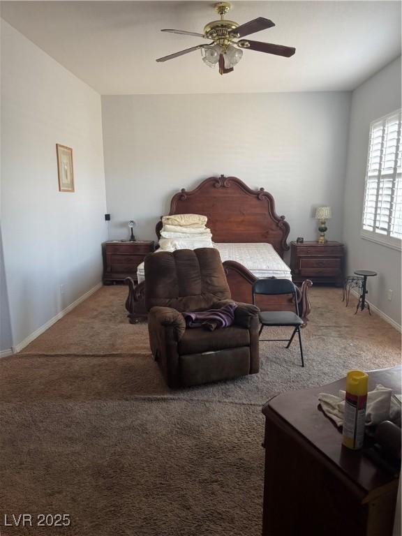 5004 Wayfaring Tree Ave, Las Vegas, NV 89131 - bedroom with carpet flooring, baseboards, and a ceiling fan