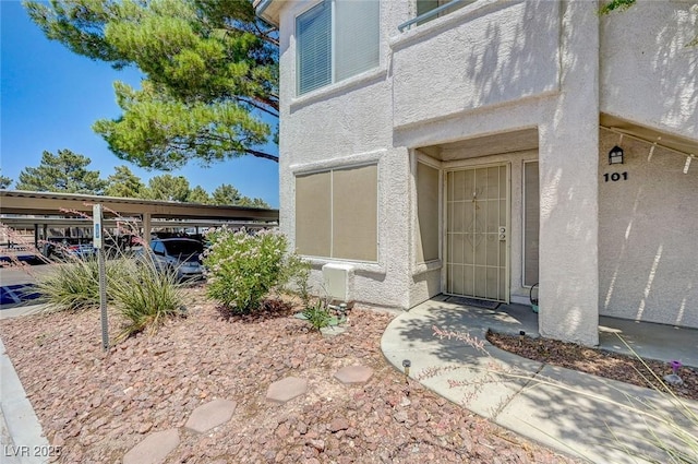 5196 Mandalay Springs Dr Unit 101, Las Vegas, NV 89120 - doorway to property featuring stucco siding