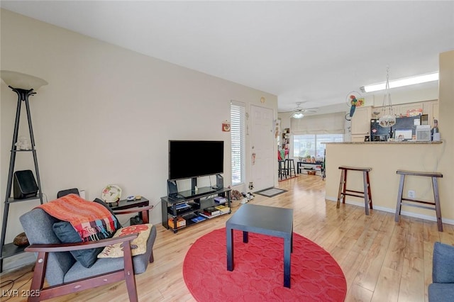 5196 Mandalay Springs Dr Unit 101, Las Vegas, NV 89120 - living area featuring light wood-type flooring and ceiling fan