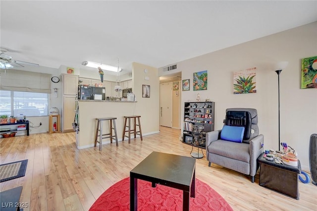 5196 Mandalay Springs Dr Unit 101, Las Vegas, NV 89120 - living room featuring ceiling fan and light wood-style flooring
