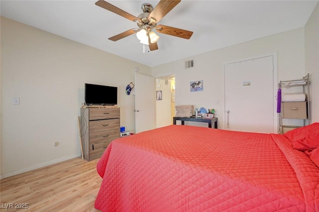 5196 Mandalay Springs Dr Unit 101, Las Vegas, NV 89120 - bedroom with light wood finished floors and a ceiling fan