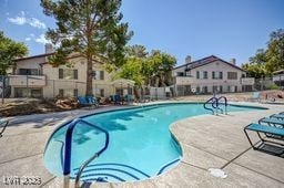 5196 Mandalay Springs Dr Unit 101, Las Vegas, NV 89120 - community pool featuring a patio area