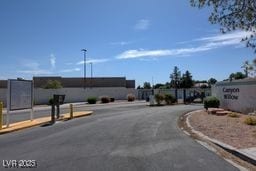 5196 Mandalay Springs Dr Unit 101, Las Vegas, NV 89120 - view of asphalt road with curbs