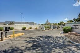 5196 Mandalay Springs Dr Unit 101, Las Vegas, NV 89120 - view of asphalt street featuring a gated entry and curbs