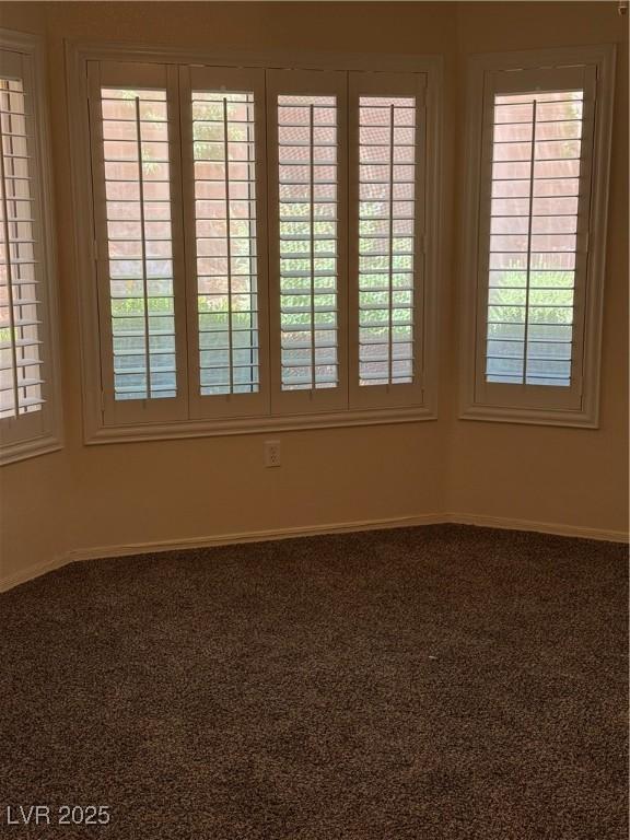 495 Edgefield Ridge Pl, Henderson, NV 89012 - empty room with plenty of natural light and carpet floors