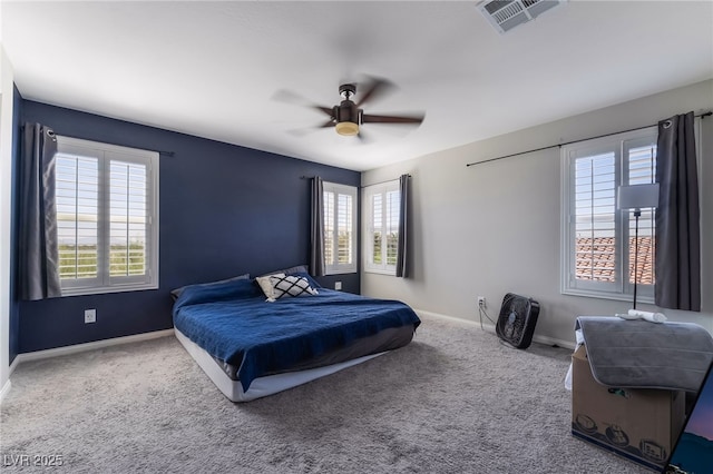 7732 Bandon Cliffs St, North Las Vegas, NV 89084 - carpeted bedroom featuring multiple windows and ceiling fan