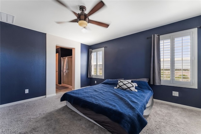 7732 Bandon Cliffs St, North Las Vegas, NV 89084 - bedroom with multiple windows, carpet, and ceiling fan
