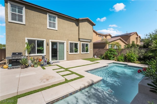 7732 Bandon Cliffs St, North Las Vegas, NV 89084 - rear view of house with stucco siding and a patio