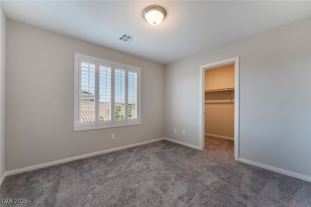 7732 Bandon Cliffs St, North Las Vegas, NV 89084 - unfurnished bedroom with carpet, a spacious closet, and a closet