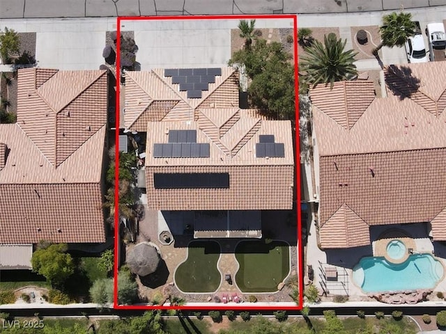 1306 Big Tree Ave, North Las Vegas, NV 89031 - aerial view of property's location featuring a pool area and property boundaries highlighted