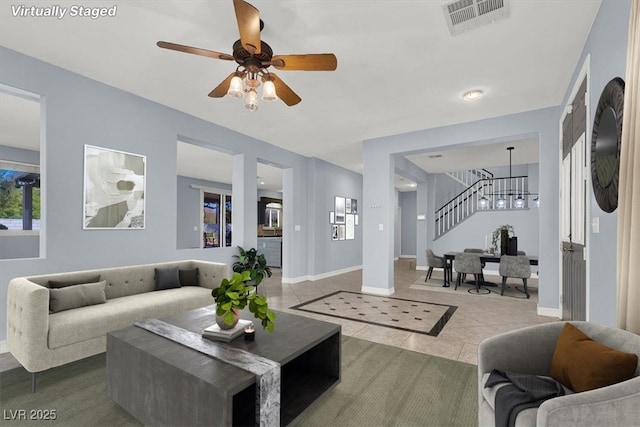 1306 Big Tree Ave, North Las Vegas, NV 89031 - living room featuring stairs, ceiling fan, tile patterned floors, and baseboards