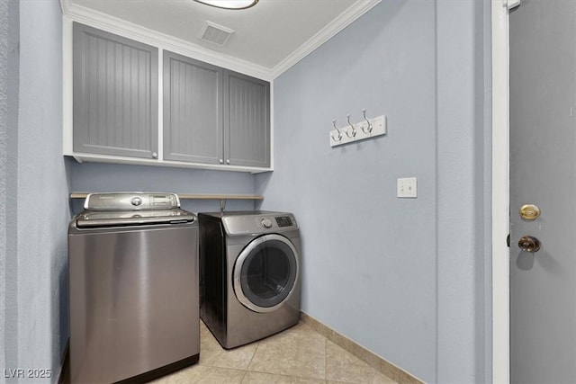 1306 Big Tree Ave, North Las Vegas, NV 89031 - washroom with cabinet space, washer and dryer, ornamental molding, light tile patterned floors, and baseboards