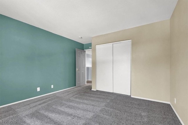 1306 Big Tree Ave, North Las Vegas, NV 89031 - unfurnished bedroom featuring carpet floors, baseboards, and a closet