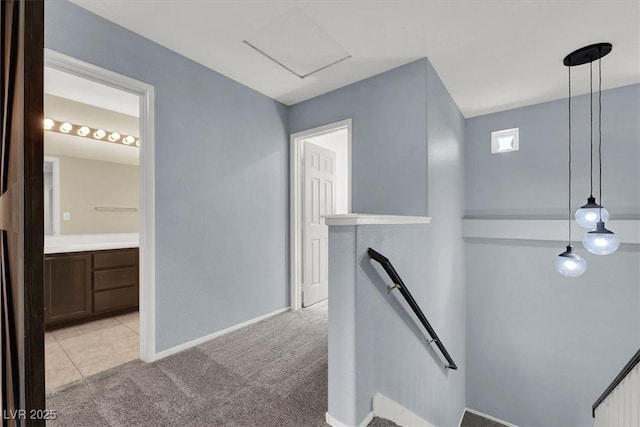 1306 Big Tree Ave, North Las Vegas, NV 89031 - hallway featuring an upstairs landing, light carpet, and baseboards