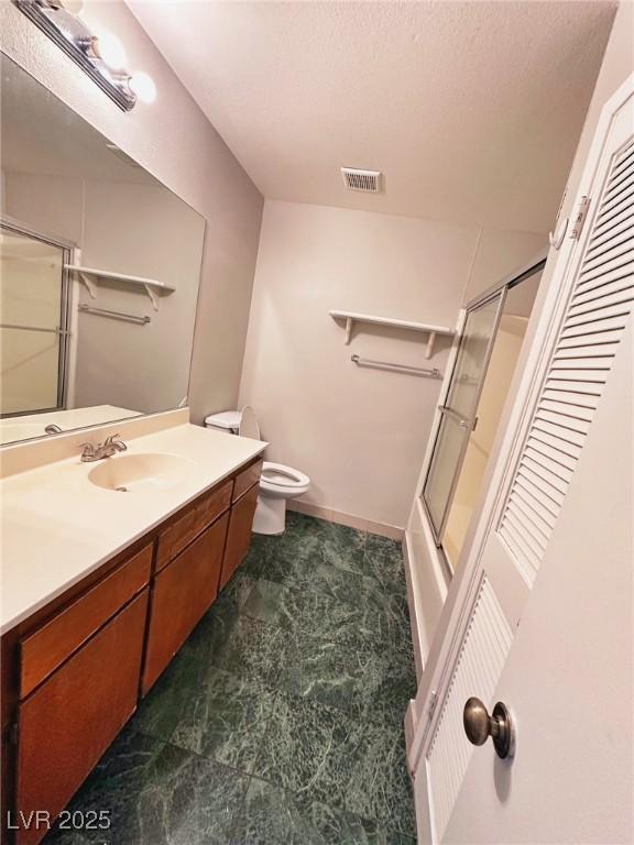 4331 Sanderling Cir Unit 46, Las Vegas, NV 89103 - bathroom featuring vanity, toilet, and enclosed tub / shower combo