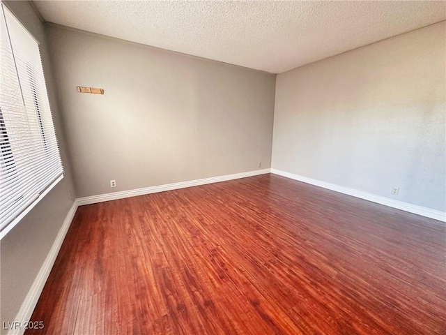 4331 Sanderling Cir Unit 46, Las Vegas, NV 89103 - spare room with dark wood-style floors, baseboards, and a textured ceiling