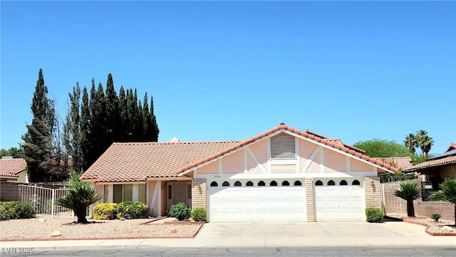 1536 Brocado Ln, Las Vegas, NV 89117 - view of front of house featuring an attached garage, stucco siding, driveway, and a tile roof