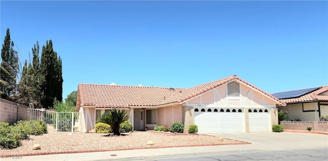 1536 Brocado Ln, Las Vegas, NV 89117 - view of front of home with a garage, concrete driveway, a tiled roof, and stucco siding