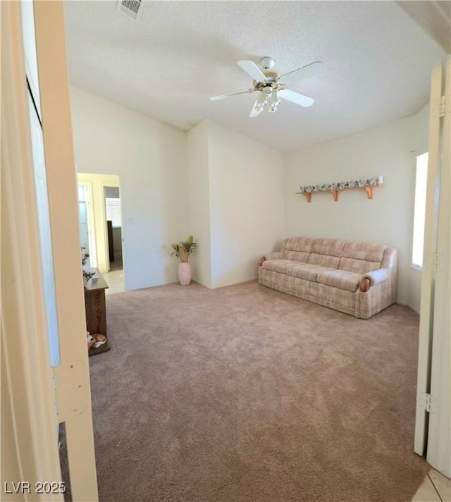 1536 Brocado Ln, Las Vegas, NV 89117 - living area with light carpet, a ceiling fan, and lofted ceiling