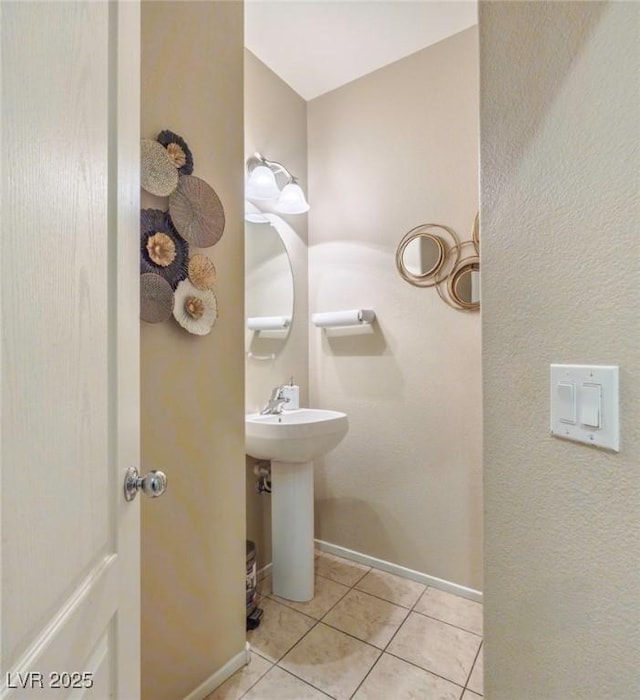 9032 Retro Ct, Las Vegas, NV 89149 - bathroom with tile patterned flooring, baseboards, and a sink