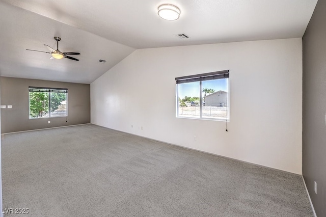 861 S Ford Loop, Pahrump, NV 89048 - spare room featuring vaulted ceiling, carpet flooring, and a ceiling fan