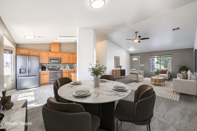 861 S Ford Loop, Pahrump, NV 89048 - dining area featuring vaulted ceiling, ceiling fan, and light carpet