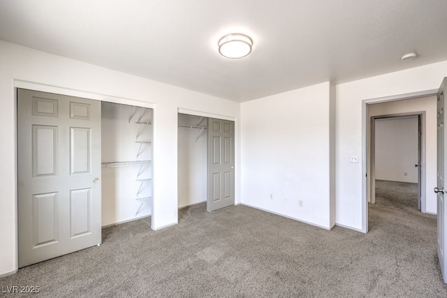861 S Ford Loop, Pahrump, NV 89048 - unfurnished bedroom with carpet, multiple closets, and baseboards