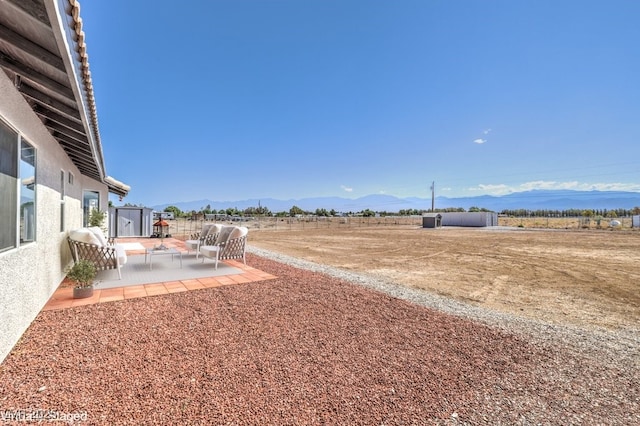 861 S Ford Loop, Pahrump, NV 89048 - view of yard with a patio area, a mountain view, and a rural view