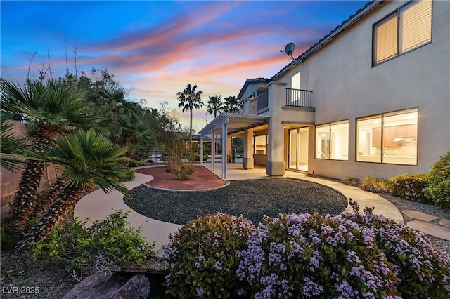 9008 Sawhill Pond St, Las Vegas, NV 89131 - back of property with a balcony, stucco siding, a patio area, and a pergola