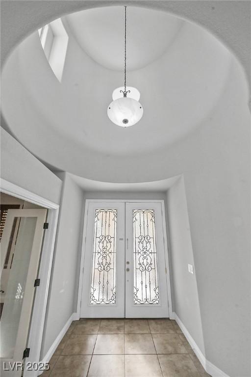 9008 Sawhill Pond St, Las Vegas, NV 89131 - tiled foyer with baseboards and french doors