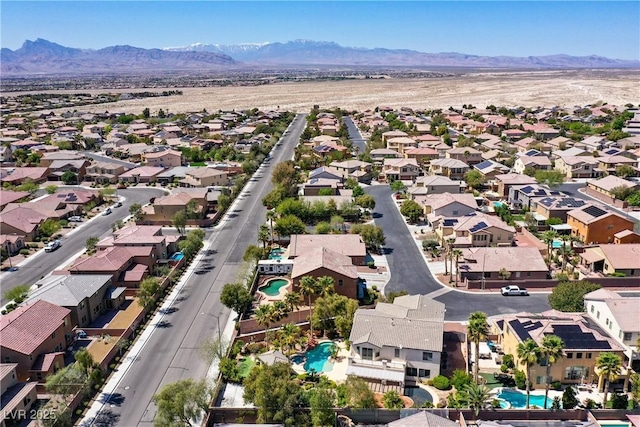 9008 Sawhill Pond St, Las Vegas, NV 89131 - aerial view of residential area featuring a mountain backdrop and a pool area