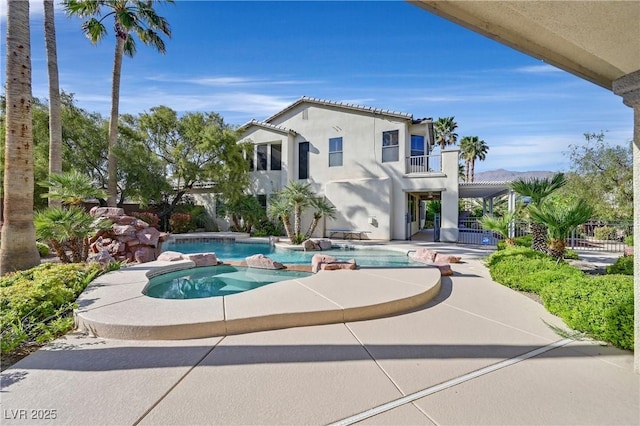 9008 Sawhill Pond St, Las Vegas, NV 89131 - view of swimming pool with a patio and a pool with connected hot tub