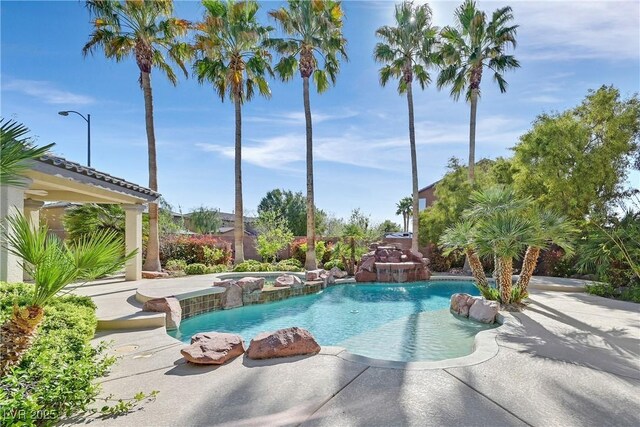 9008 Sawhill Pond St, Las Vegas, NV 89131 - outdoor pool with a hot tub and a patio