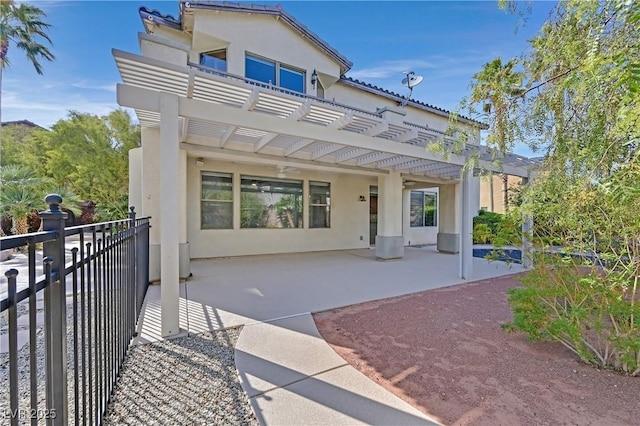 9008 Sawhill Pond St, Las Vegas, NV 89131 - rear view of property with a pergola, a balcony, stucco siding, and a patio area