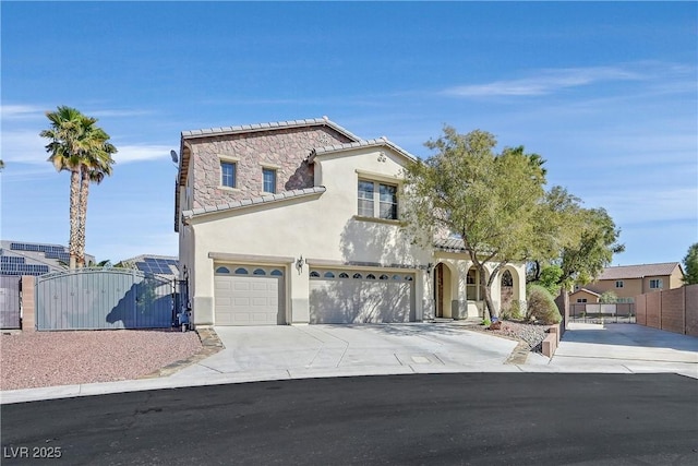 9008 Sawhill Pond St, Las Vegas, NV 89131 - mediterranean / spanish-style home featuring a gate, stucco siding, driveway, a garage, and a tile roof