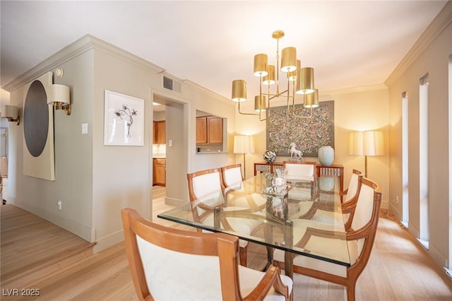 794 Oakmont Ave Unit 106, Las Vegas, NV 89109 - dining room featuring light wood-type flooring, a chandelier, baseboards, and crown molding