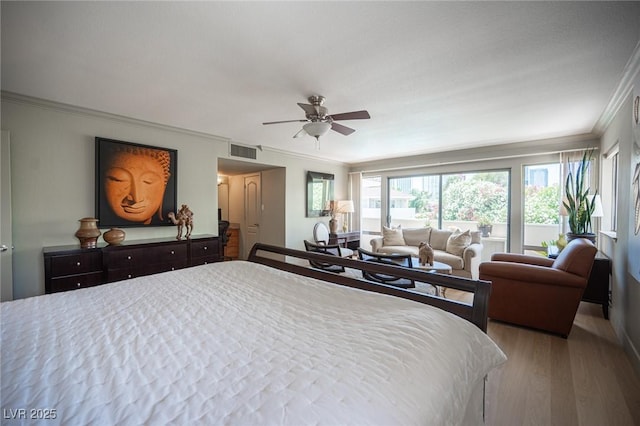 794 Oakmont Ave Unit 106, Las Vegas, NV 89109 - bedroom featuring crown molding, wood finished floors, and a ceiling fan
