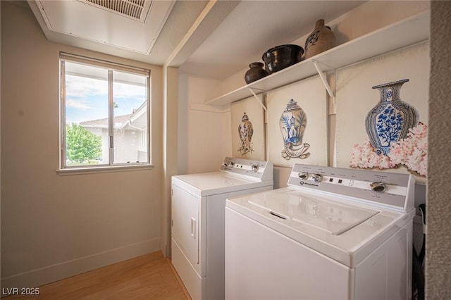 794 Oakmont Ave Unit 106, Las Vegas, NV 89109 - washroom with washing machine and dryer, light wood-style floors, and baseboards